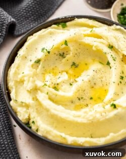 Closeup of fluffy mashed potato in a bowl.