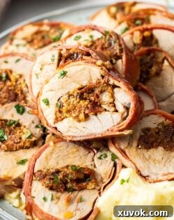 A pile of slices of stuffed pork tenderloin, showcasing the delicious filling and crispy prosciutto.