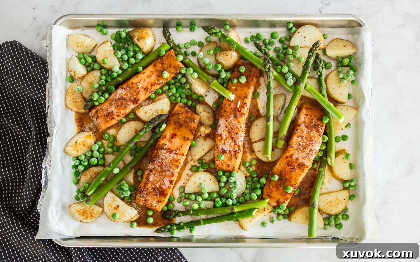The peas added to the baking tray.