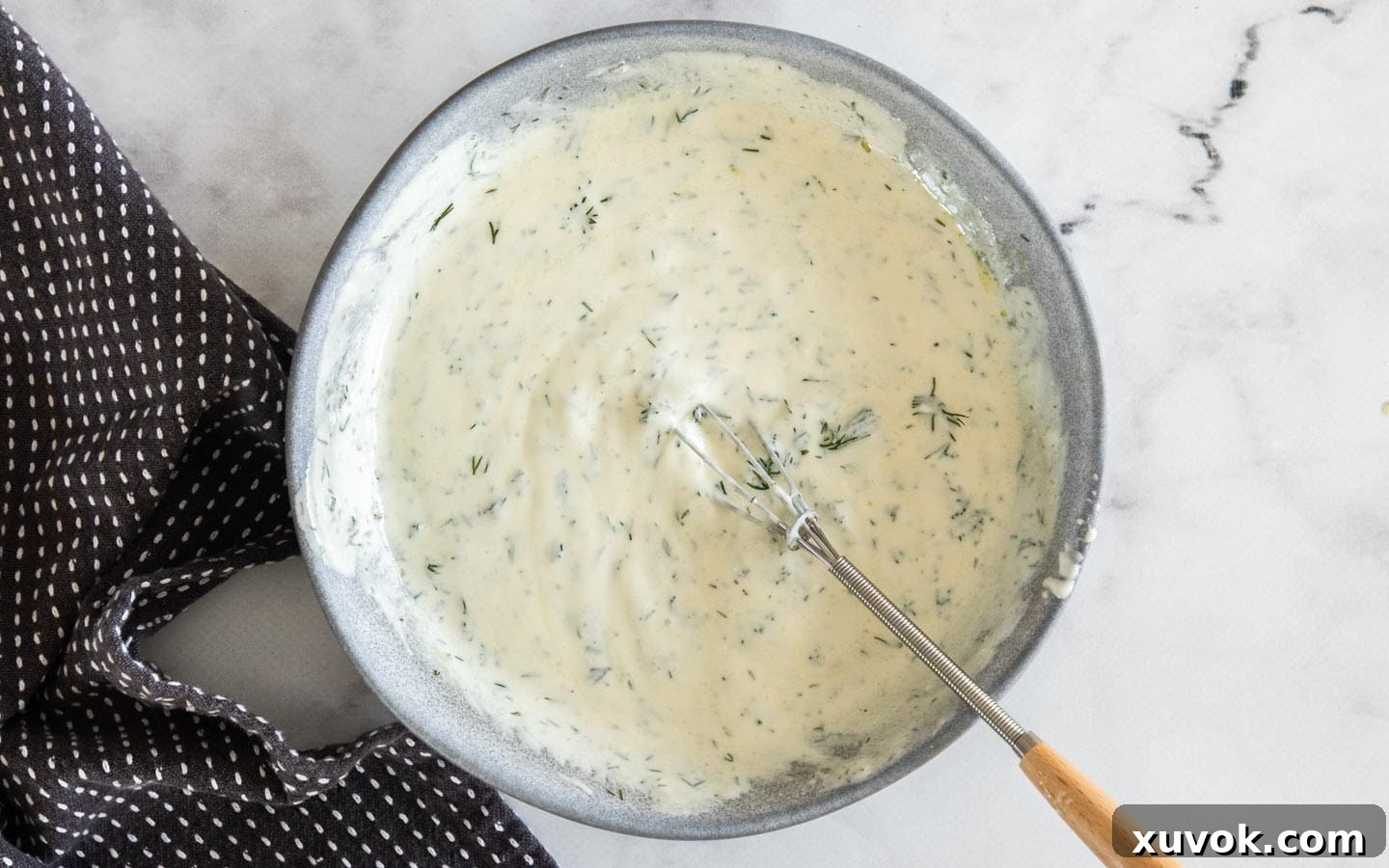 The yogurt dressing combined in a bowl.