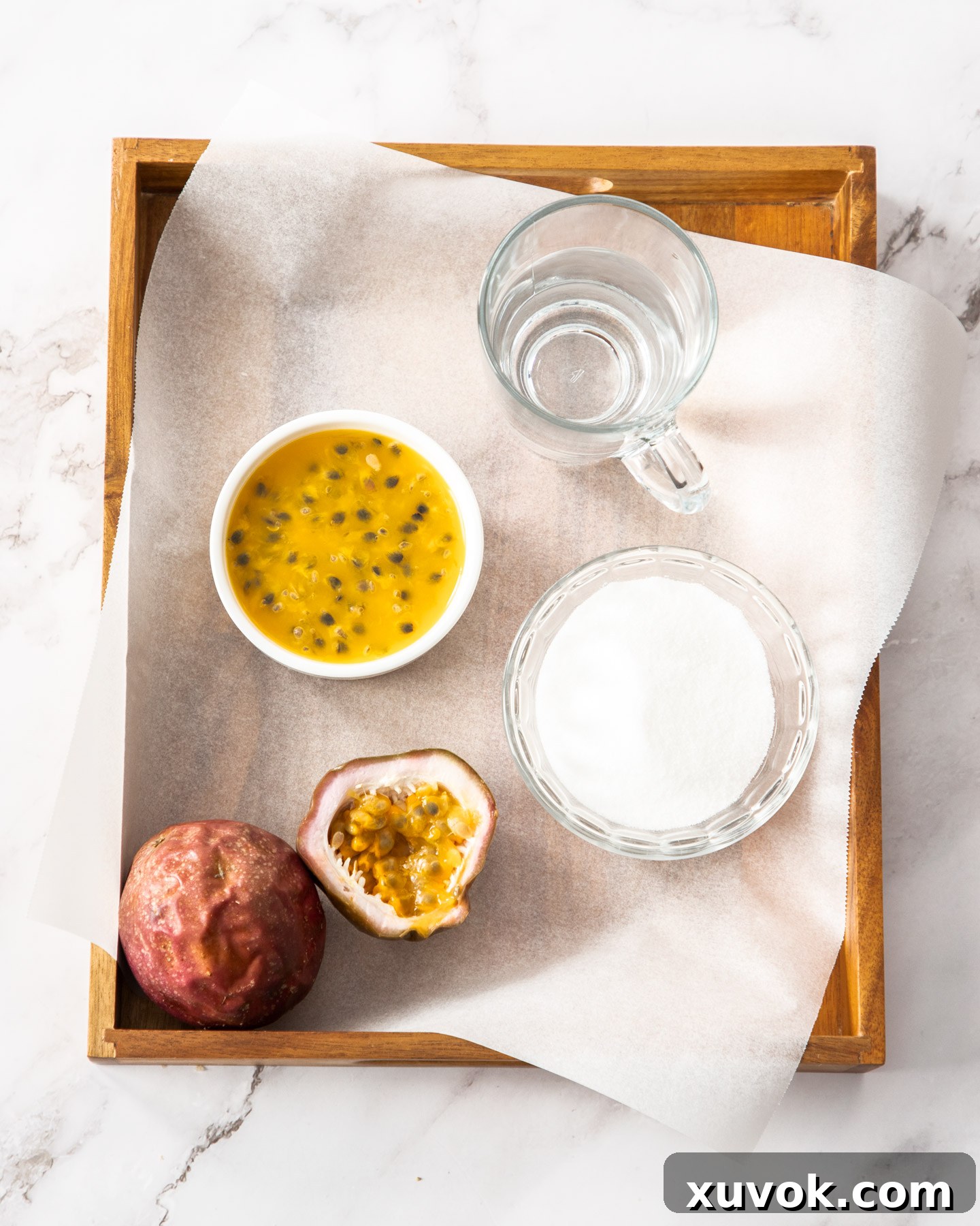 Ingredients for passionfruit syrup on a wooden tray.