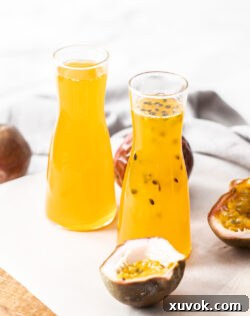 Two bottles filled with passionfruit syrup.