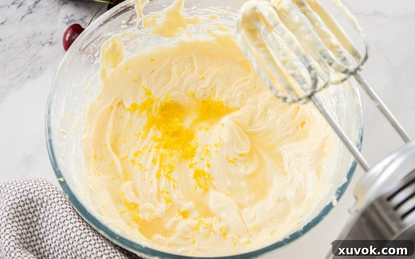 Lemon zest added to the cheesecake mixture.
