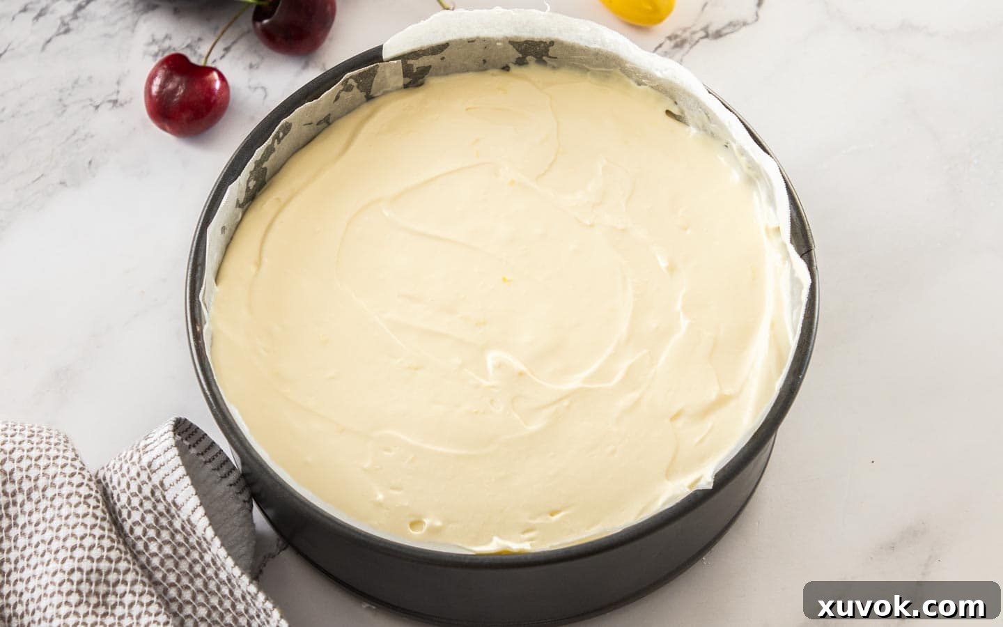 The cheescake batter in a pan ready to bake.