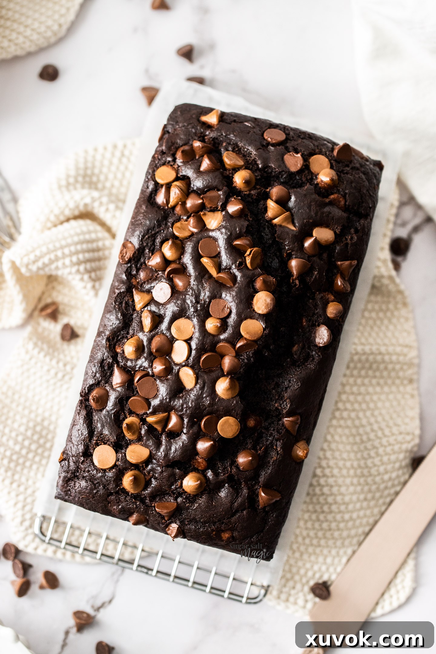 Top down view of a perfectly baked chocolate zucchini cake, showcasing its rich brown color and tender crumb.