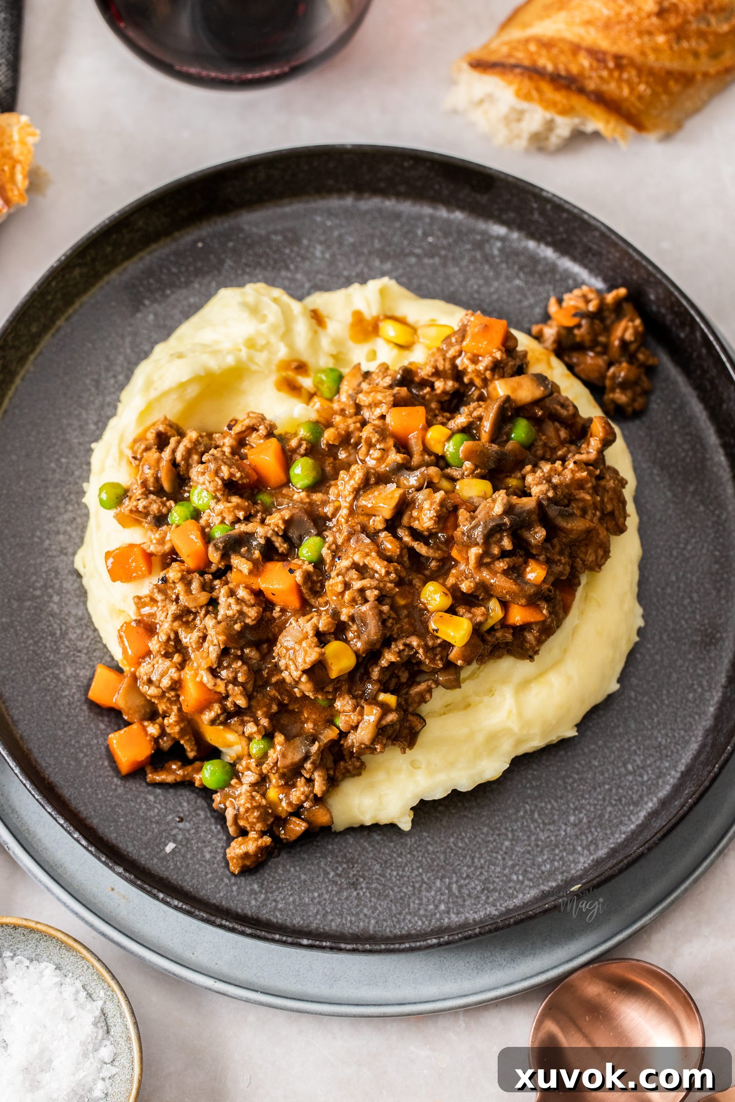 A dinner plate featuring savoury mince generously served over mashed potato.