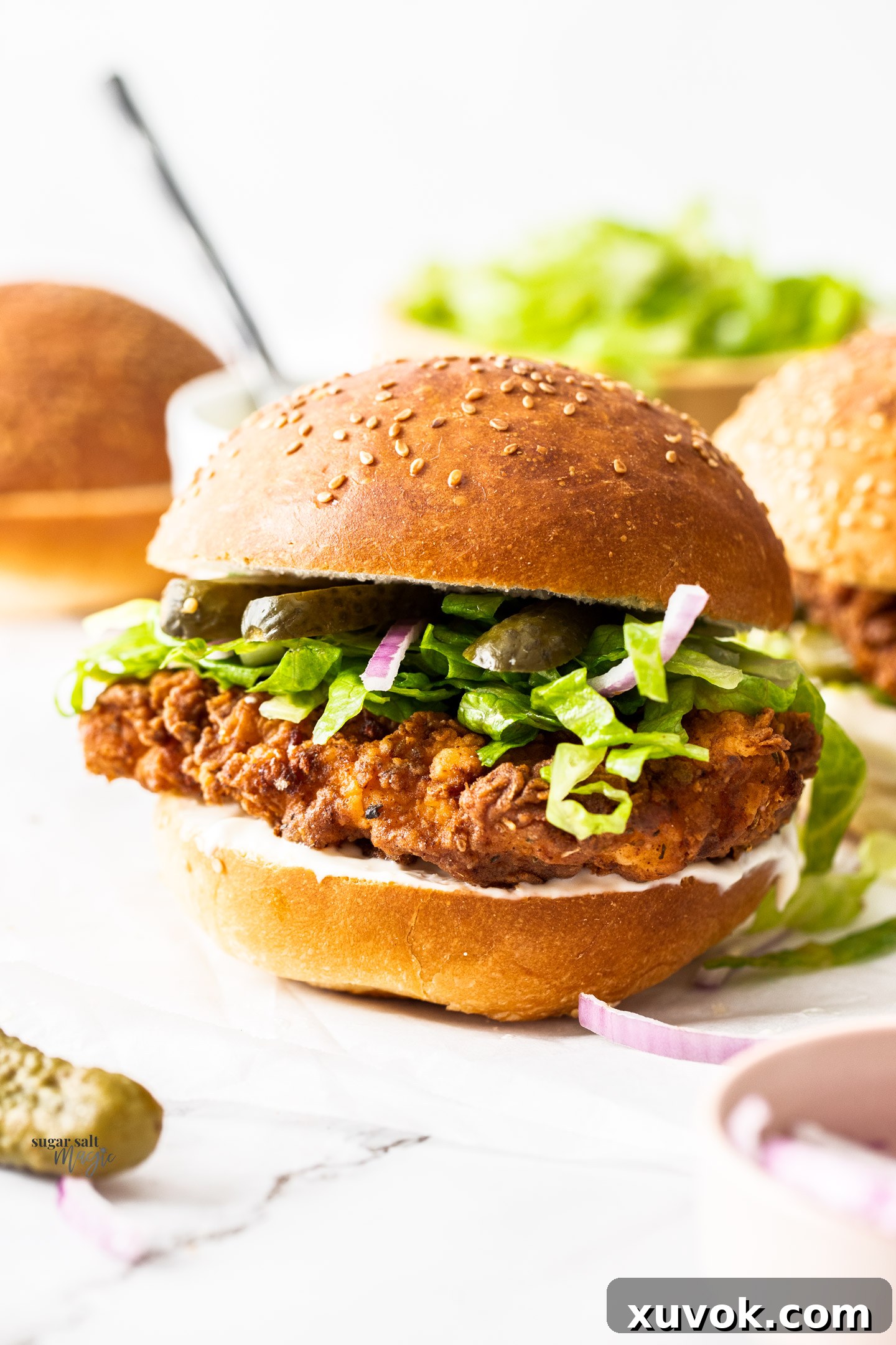 A crispy chicken burger with fresh toppings.