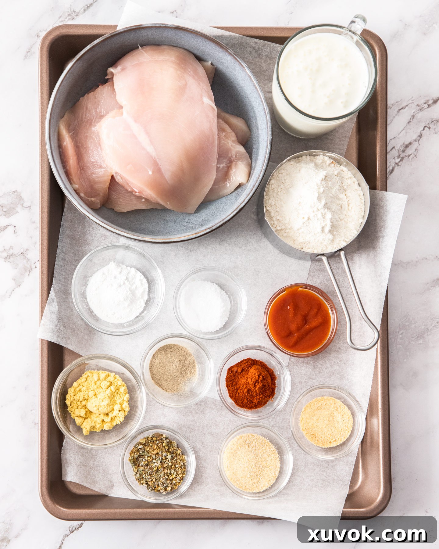 Ingredients for buttermilk fried chicken breasts laid out.