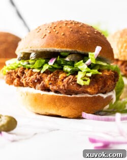 Crispy chicken burger close up, showcasing the texture.