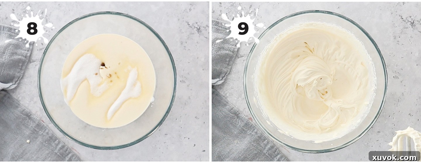 Freshly whipped Chantilly cream in a large mixing bowl, showing firm peaks.