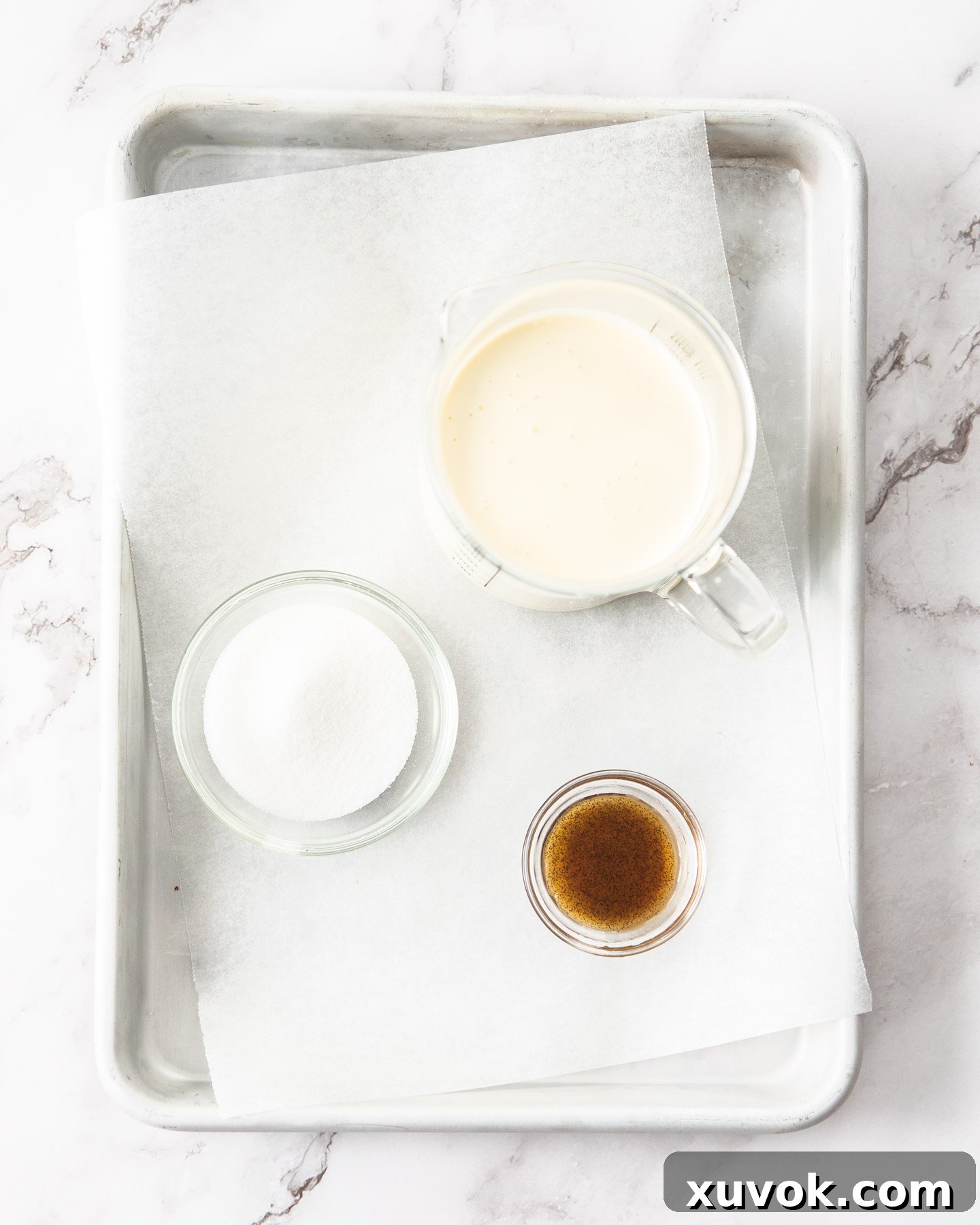 Ingredients for Chantilly cream laid out on a baking tray.