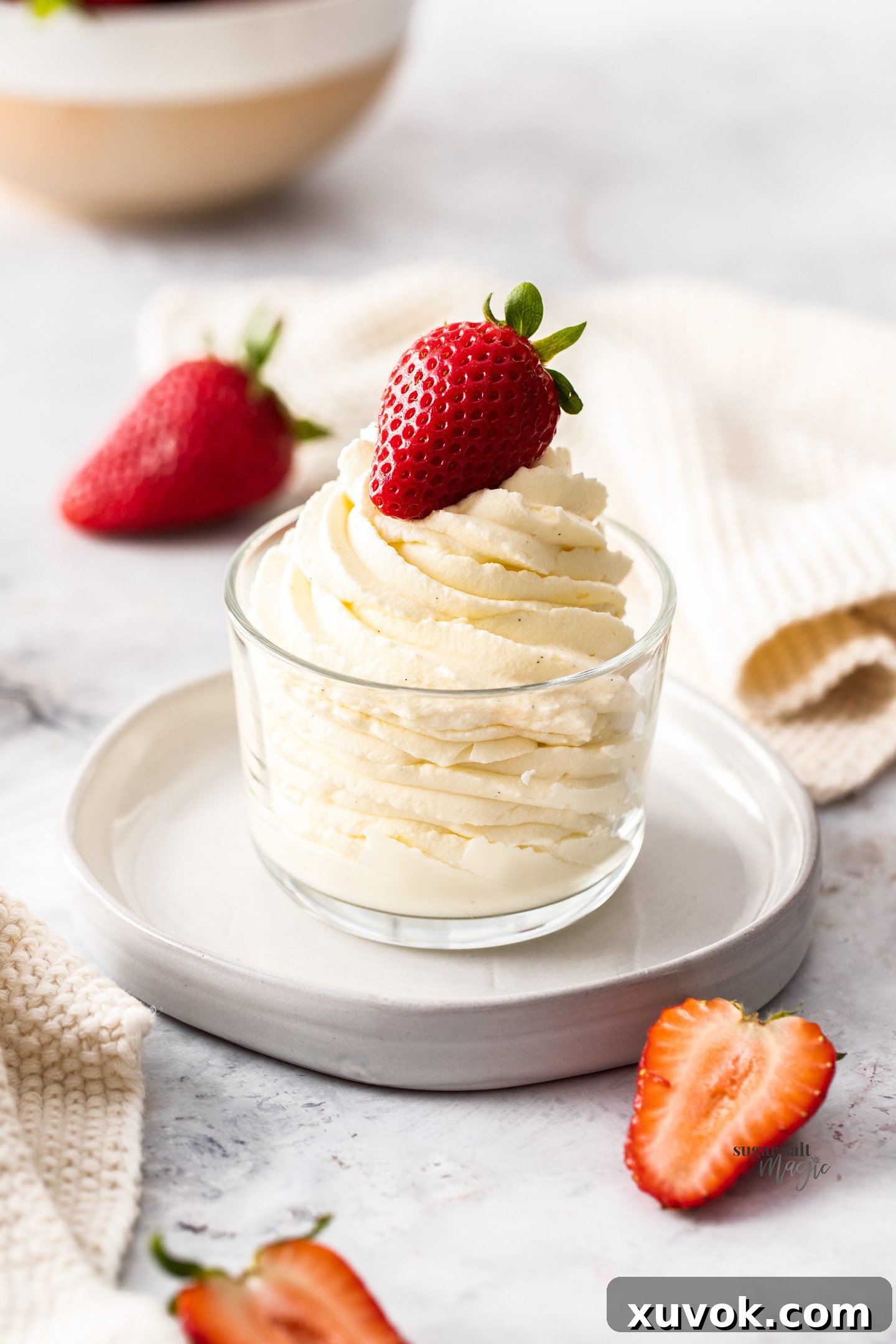 Chantilly cream piped elegantly in a swirl in a glass, ready for serving.