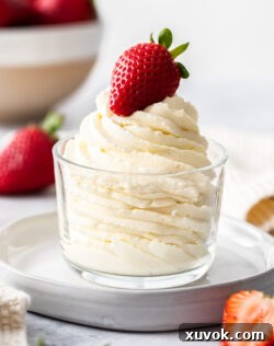 Chantilly cream piped elegantly in a swirl in a glass.