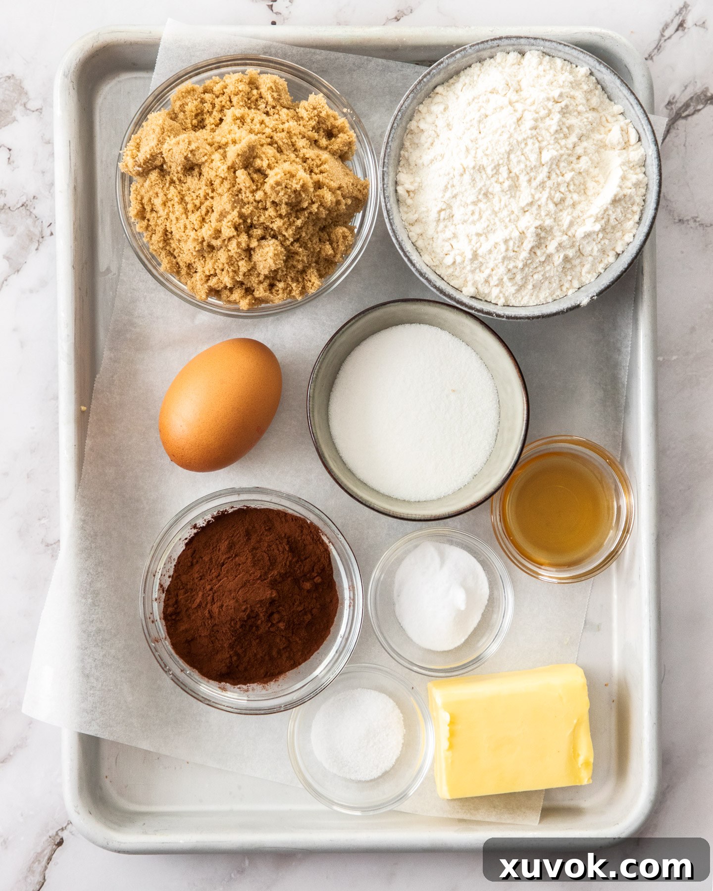 Ingredients for marble cookies artfully arranged on a baking tray, ready for mixing.