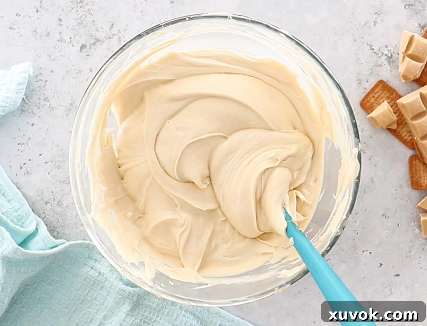 Fluffy whipped cream gently folded into the Caramilk cheesecake filling, ensuring a light and airy texture.