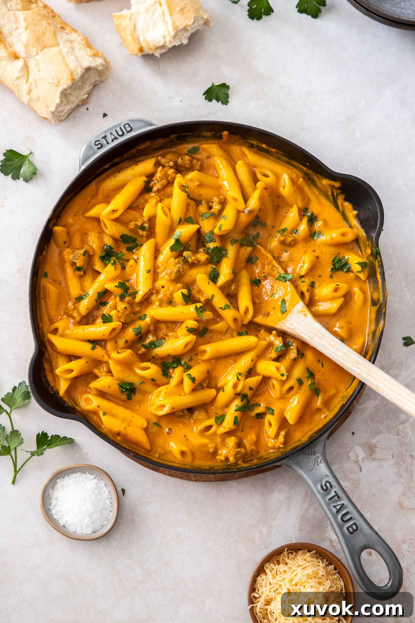 Penne pasta in pumpkin sauce in a skillet.