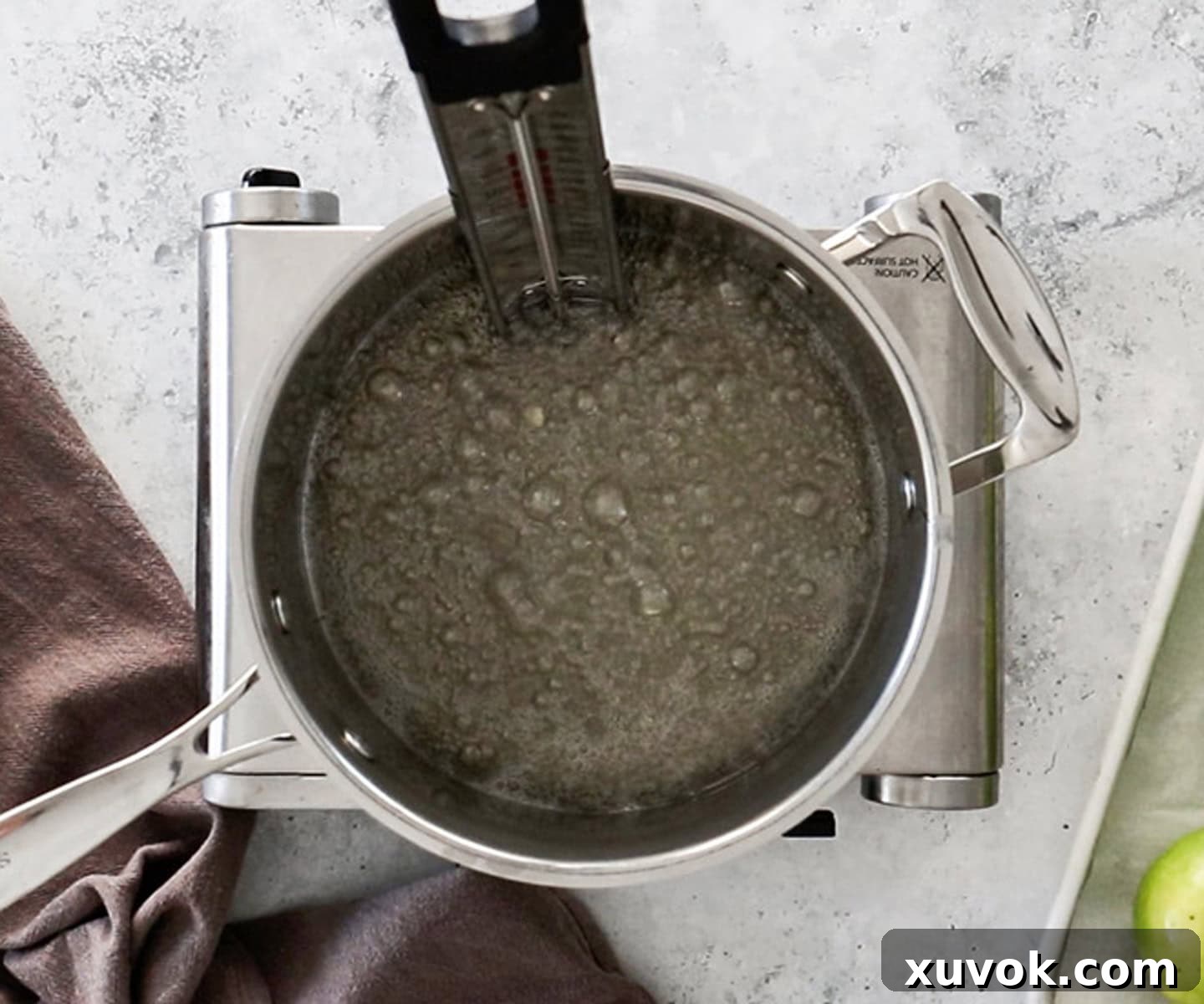 The sugar syrup bubbling in a pan.