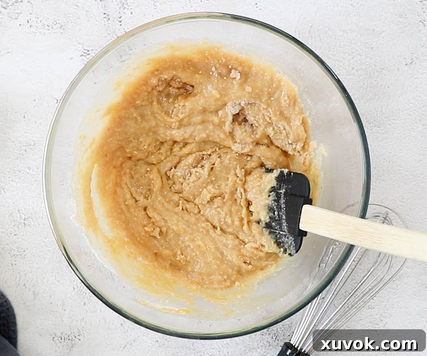 The wet and dry ingredients combined in a mixing bowl for the blondie batter.
