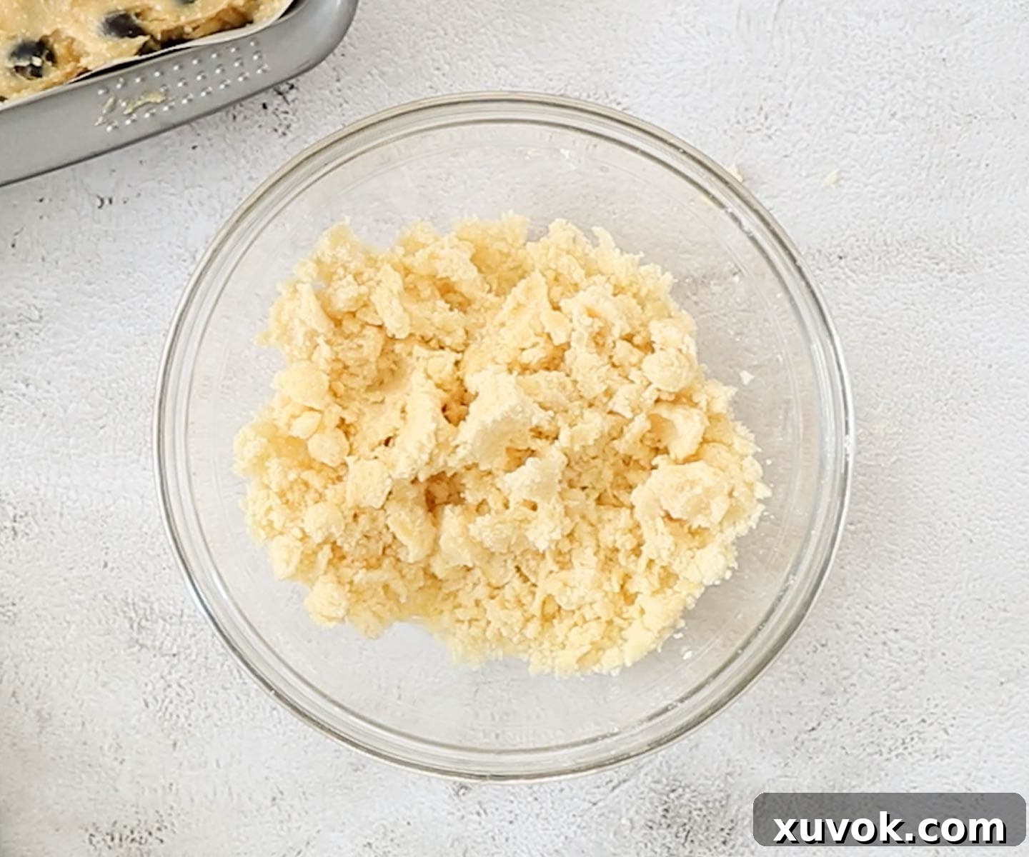 The streusel crumble mixture in a mixing bowl, perfectly prepared for use.