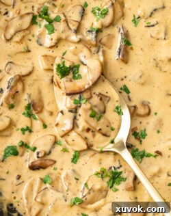 Closeup of mushroom sauce in a skillet, showcasing its creamy texture.