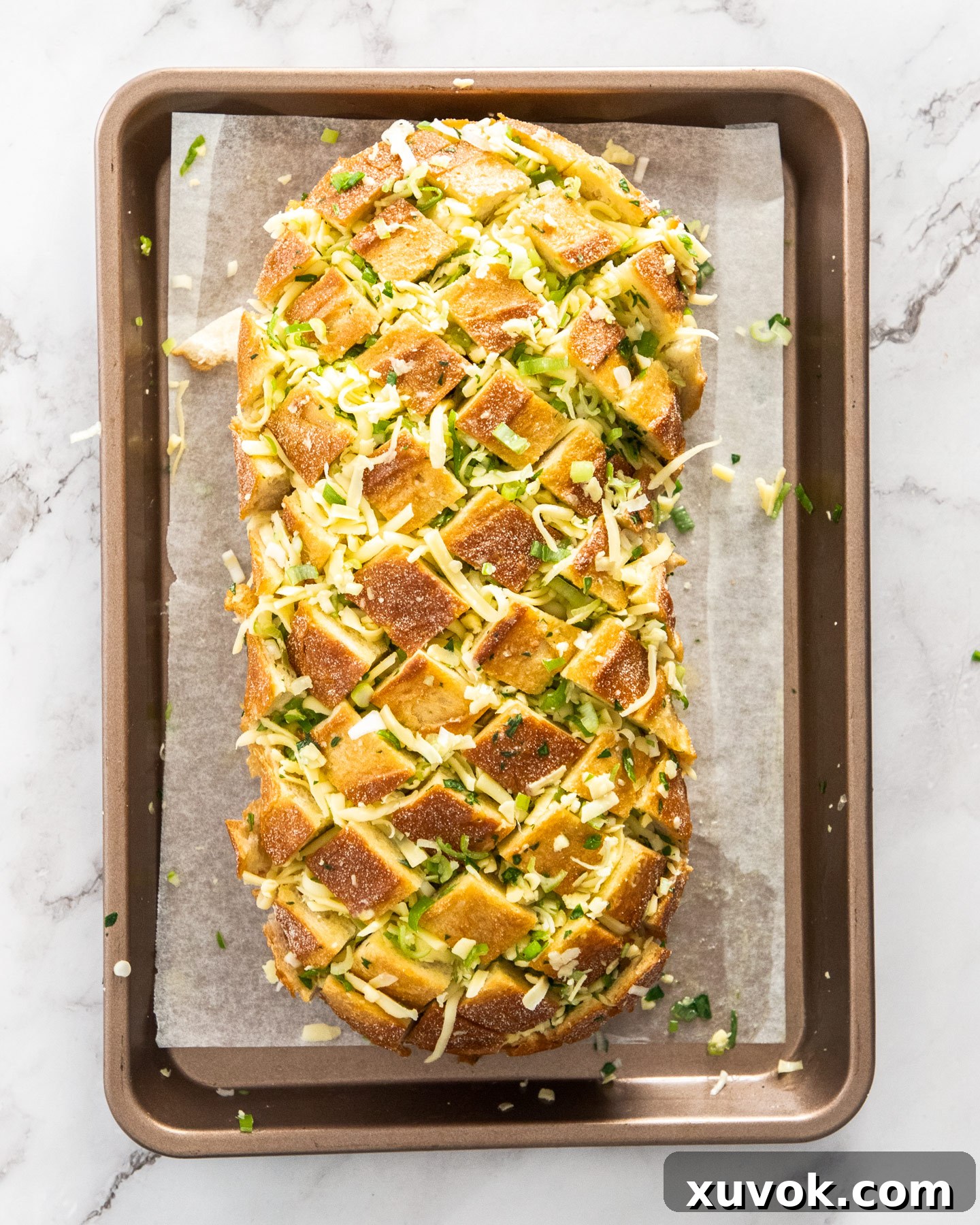 Top down view of the cheesy loaf before baking.