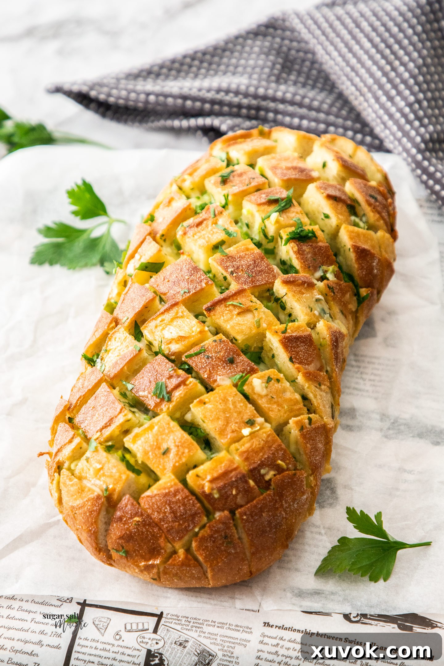A baked cheesy pull apart bread.