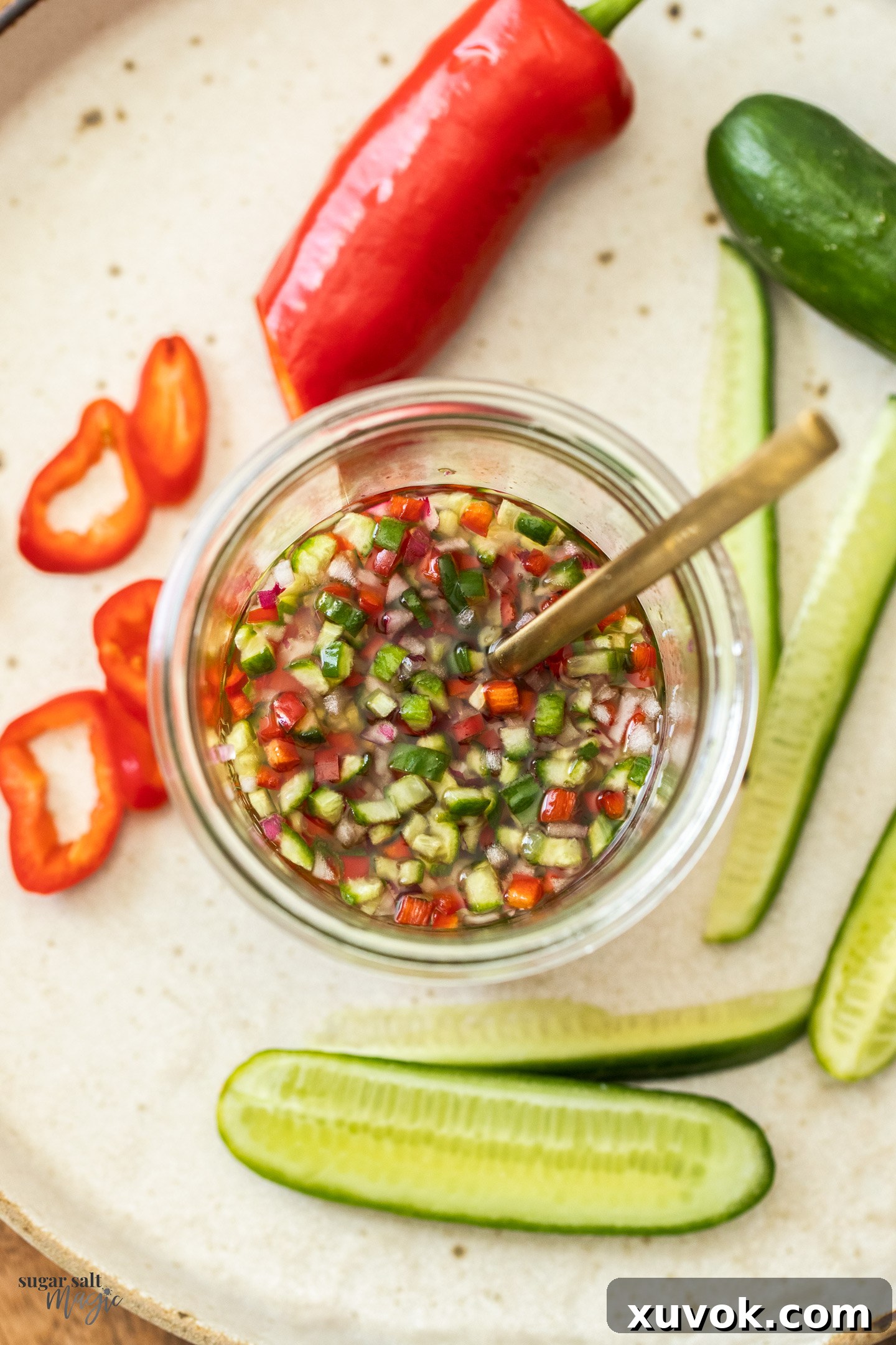 Top down view of a jar of Thai cucumber relish.