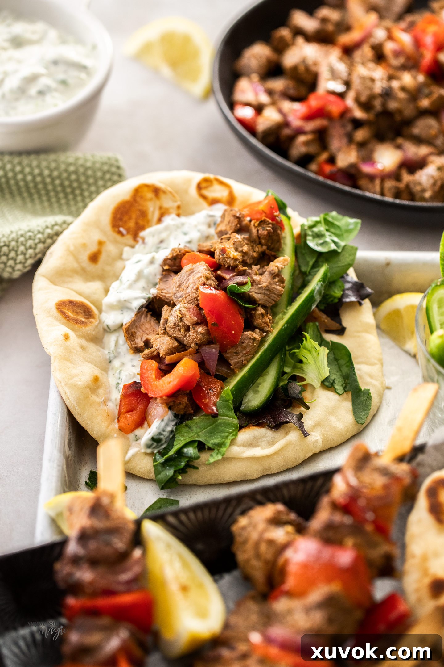 Chopped lamb kebabs served inside a pita bread with fresh toppings.