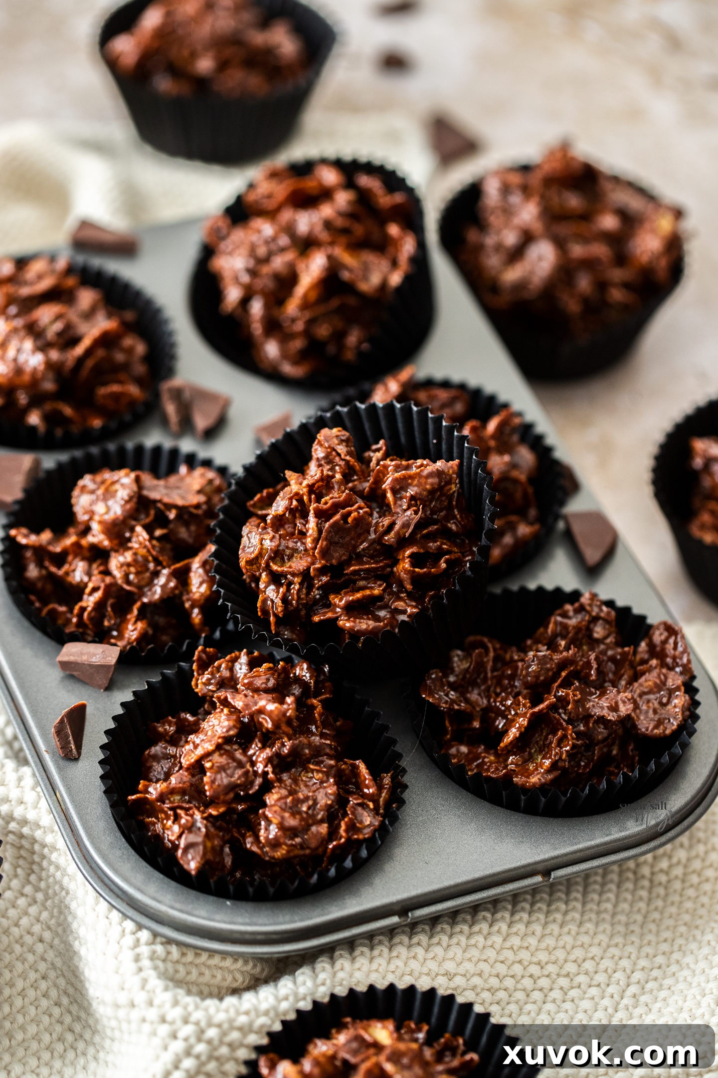 A chocolate cornflake cake on an angle.