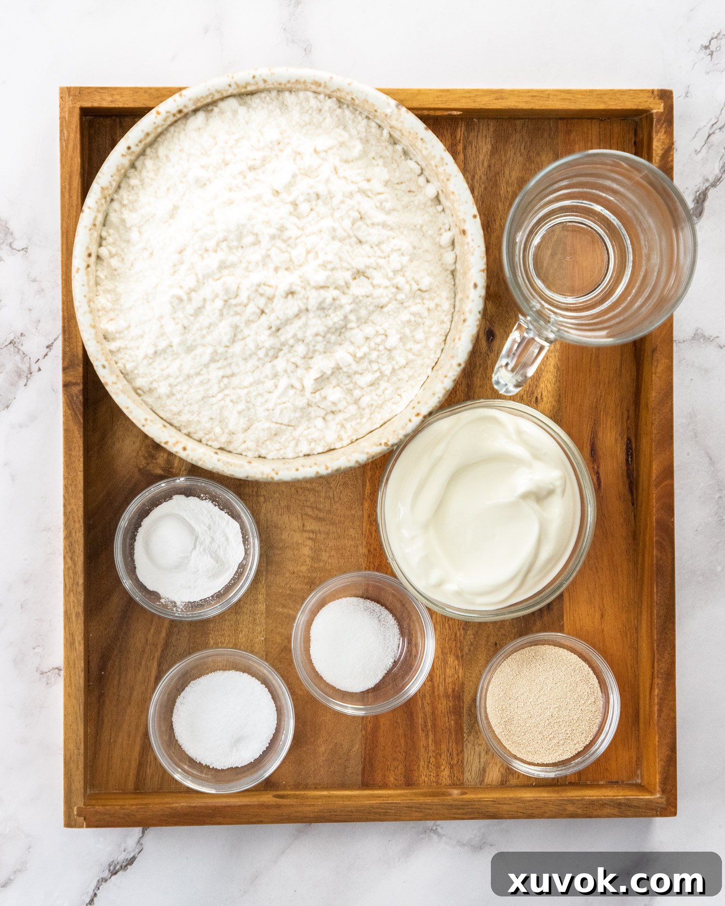Ingredients for bazlama on a wooden tray.
