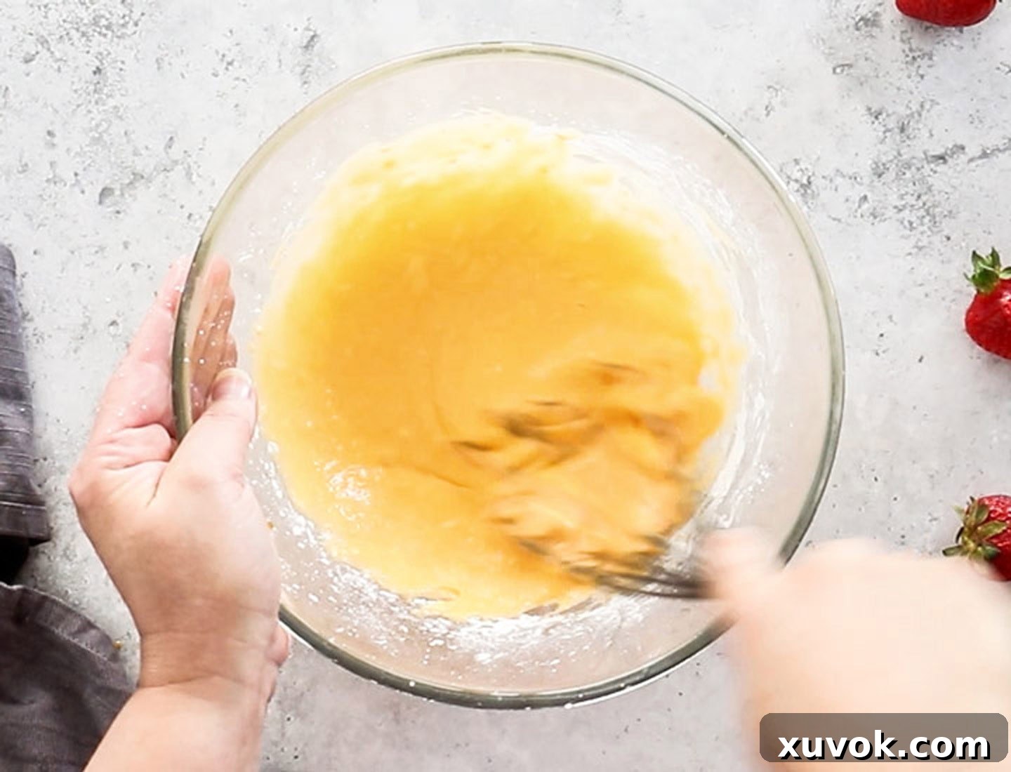 The eggs and cornflour beingw whisked together in a mixing bowl.