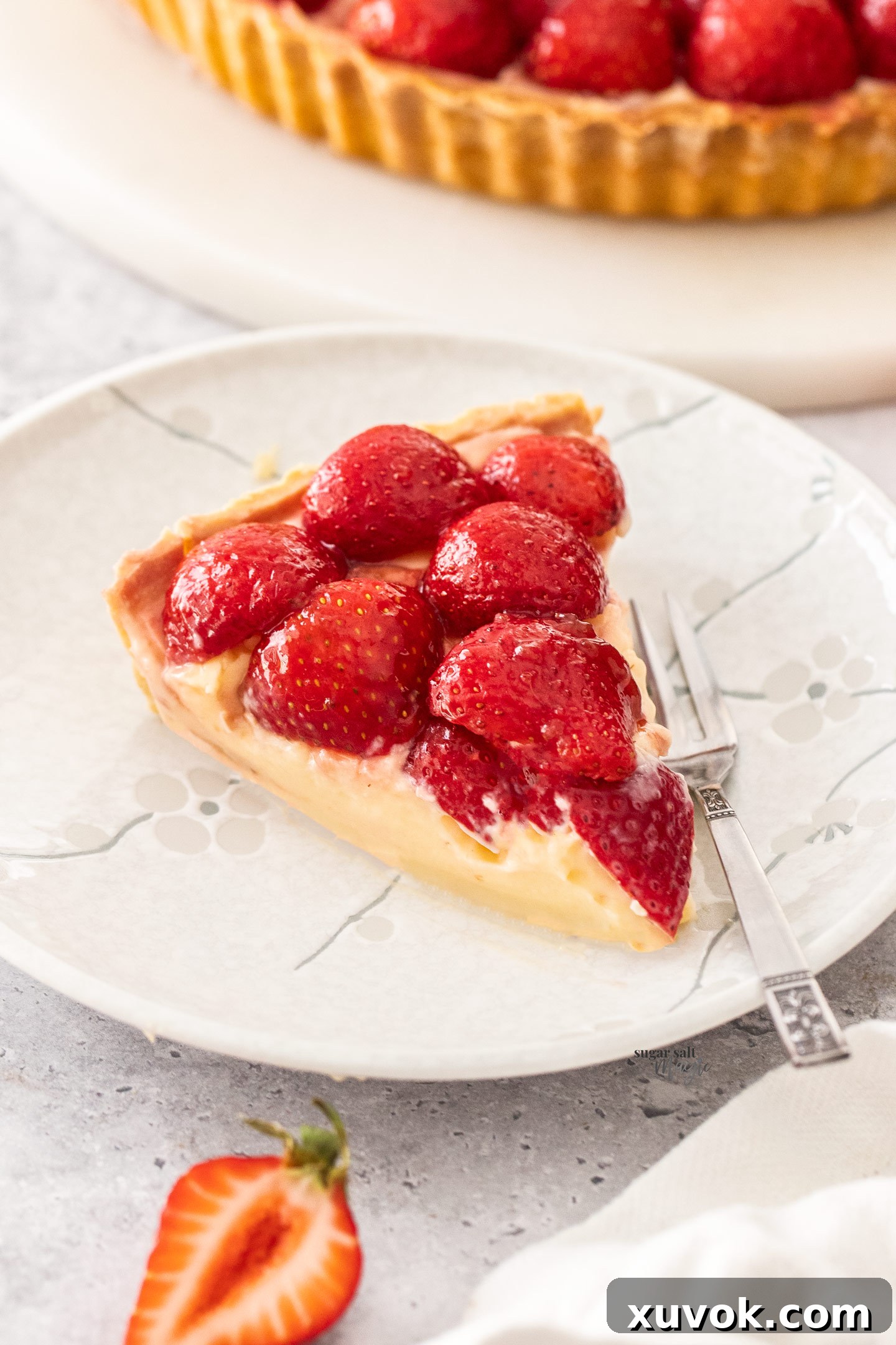 A slice of strawberry custard tart.