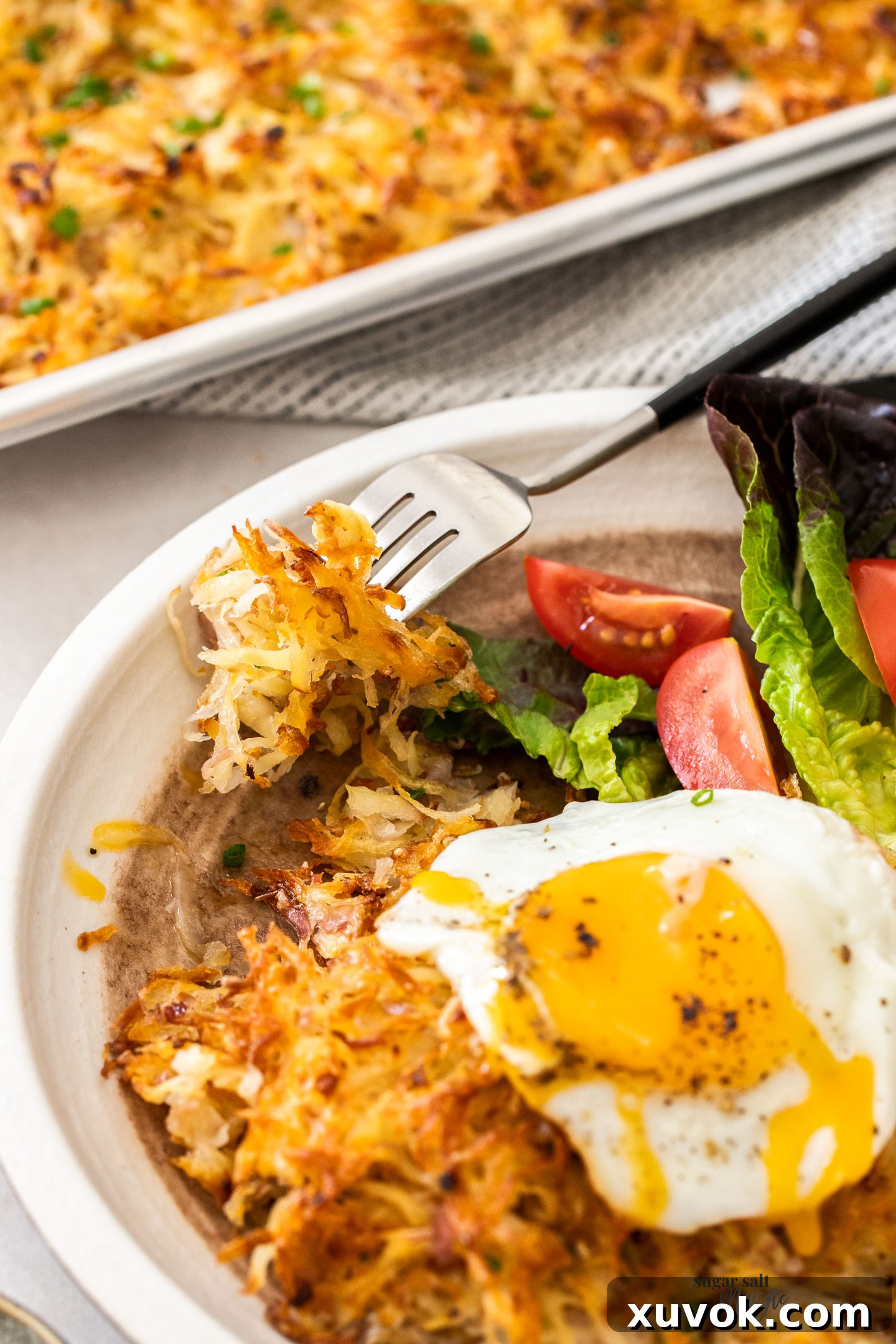 Hash browns on a fork.
