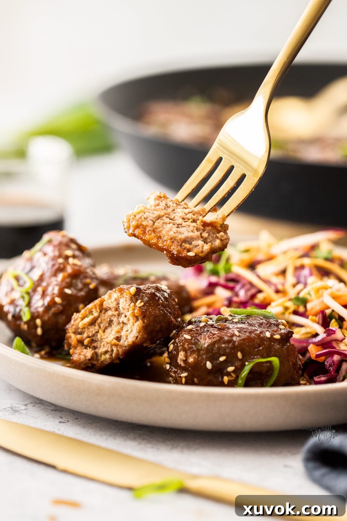 A fork taking a piece of rissole away.