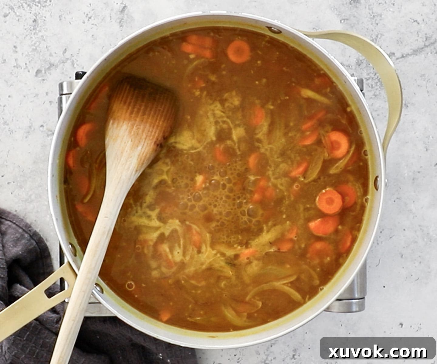 The curry gravy simmering in a pan.