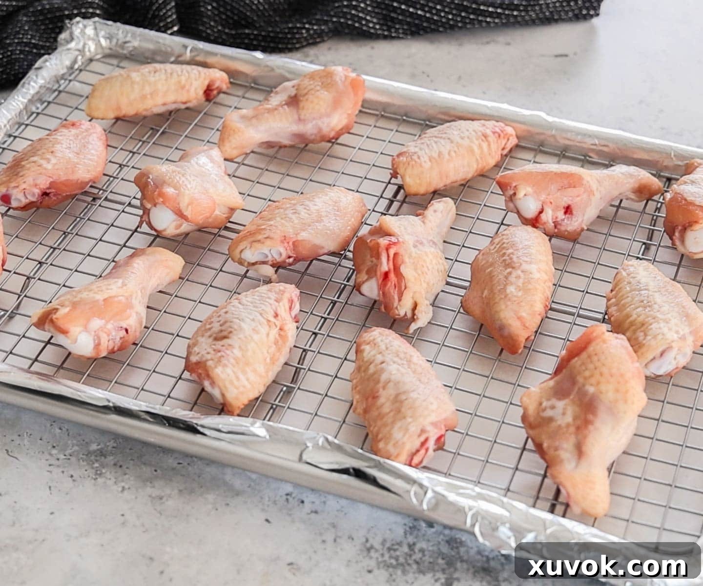 Raw chicken wings after they've dried in the fridge.