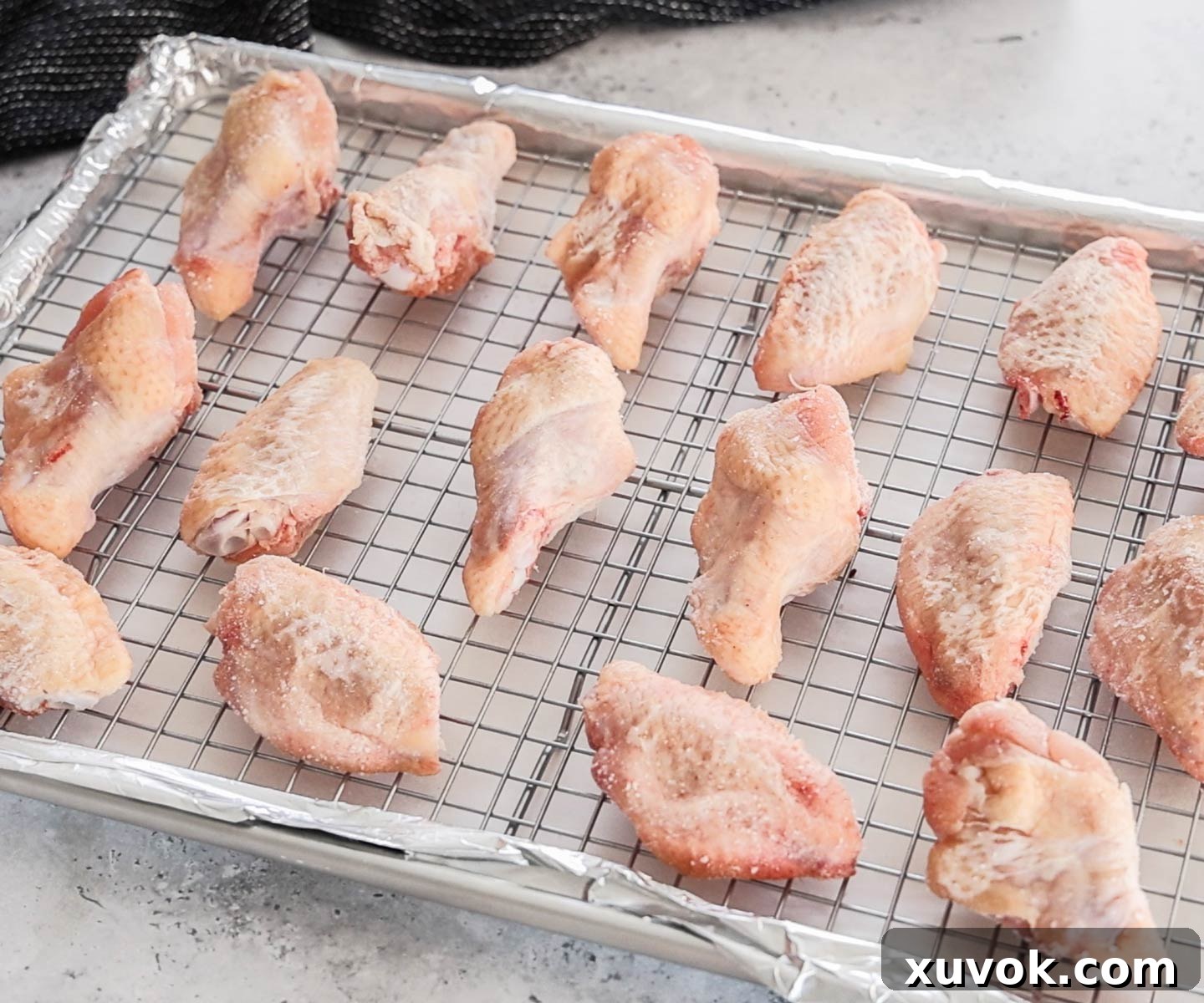 Chicken wings with seasoning ready to bake.