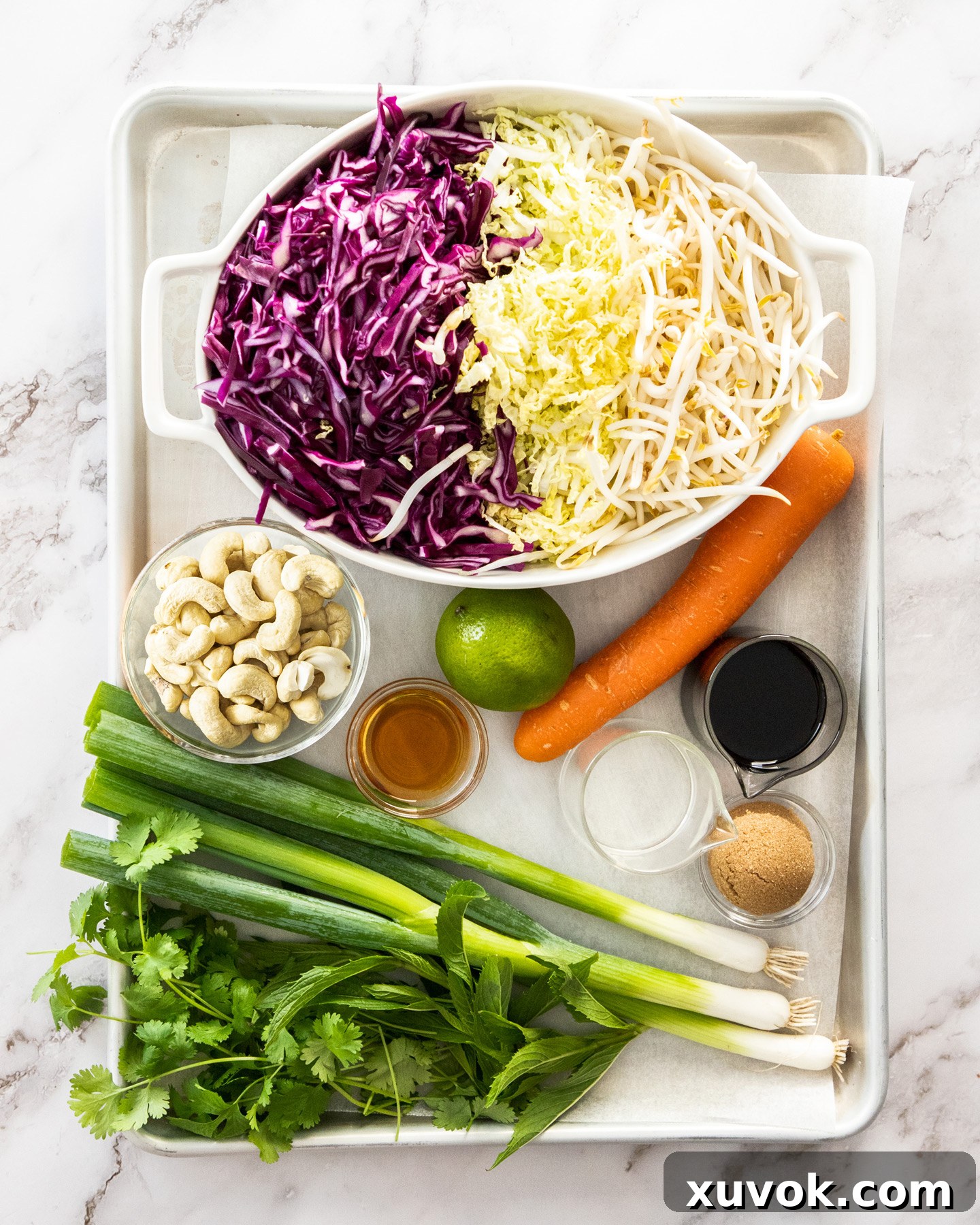 Ingredients for Asian slaw on a baking tray.