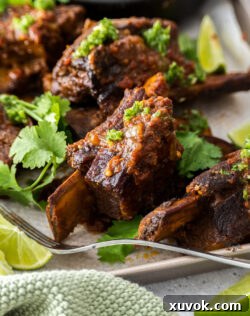 Cooked short ribs on a baking tray.