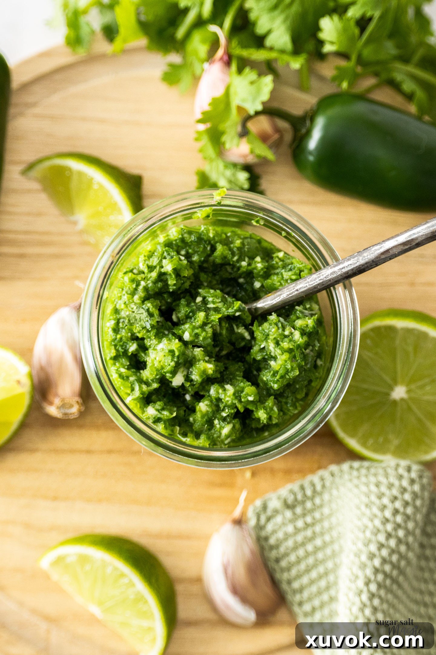 Top down view of vibrant green jalapeno relish in a glass jar, ready for serving.