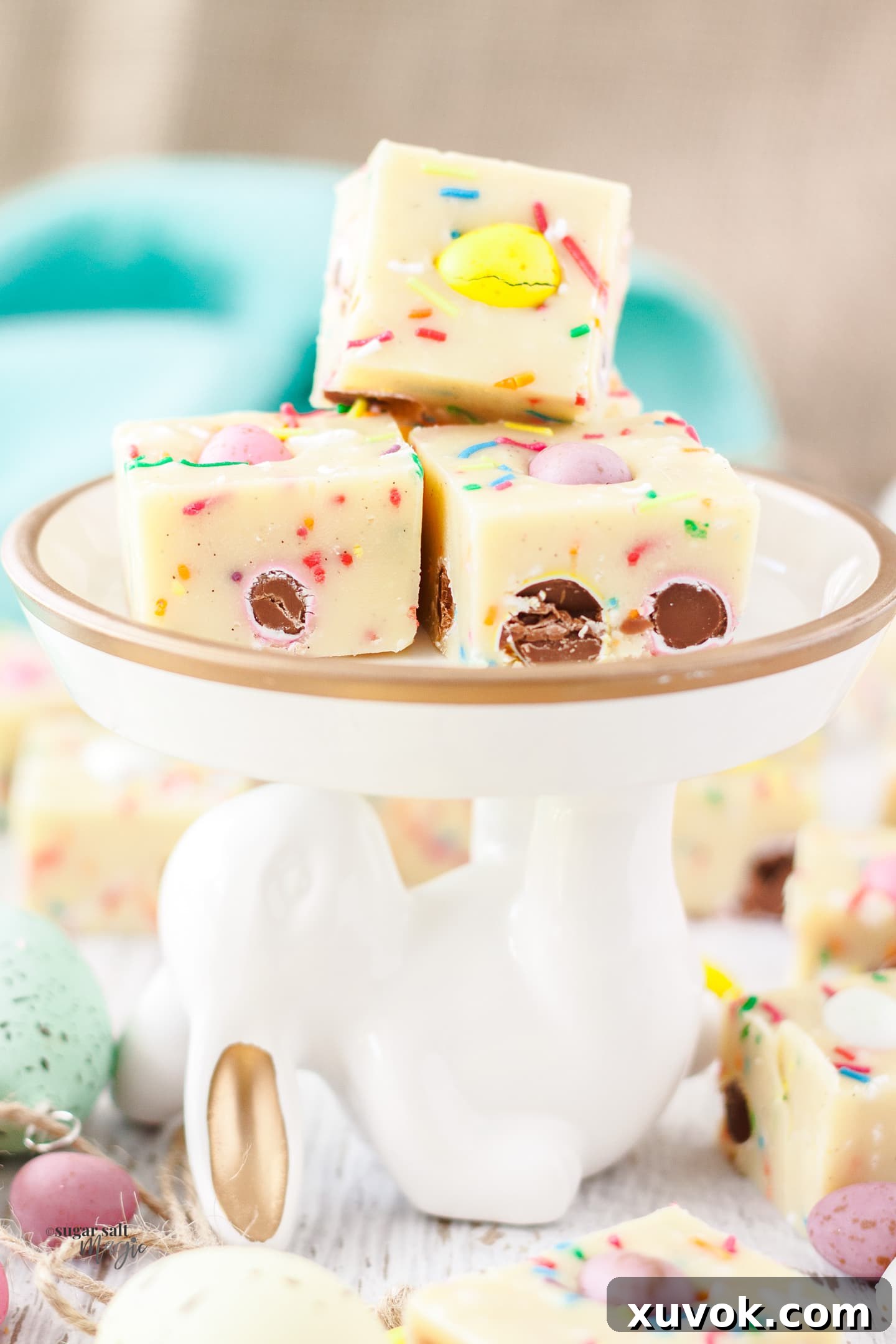 3 pieces of mini eggs fudge on top of a bunny shaped plate. A perfect Easter treat.