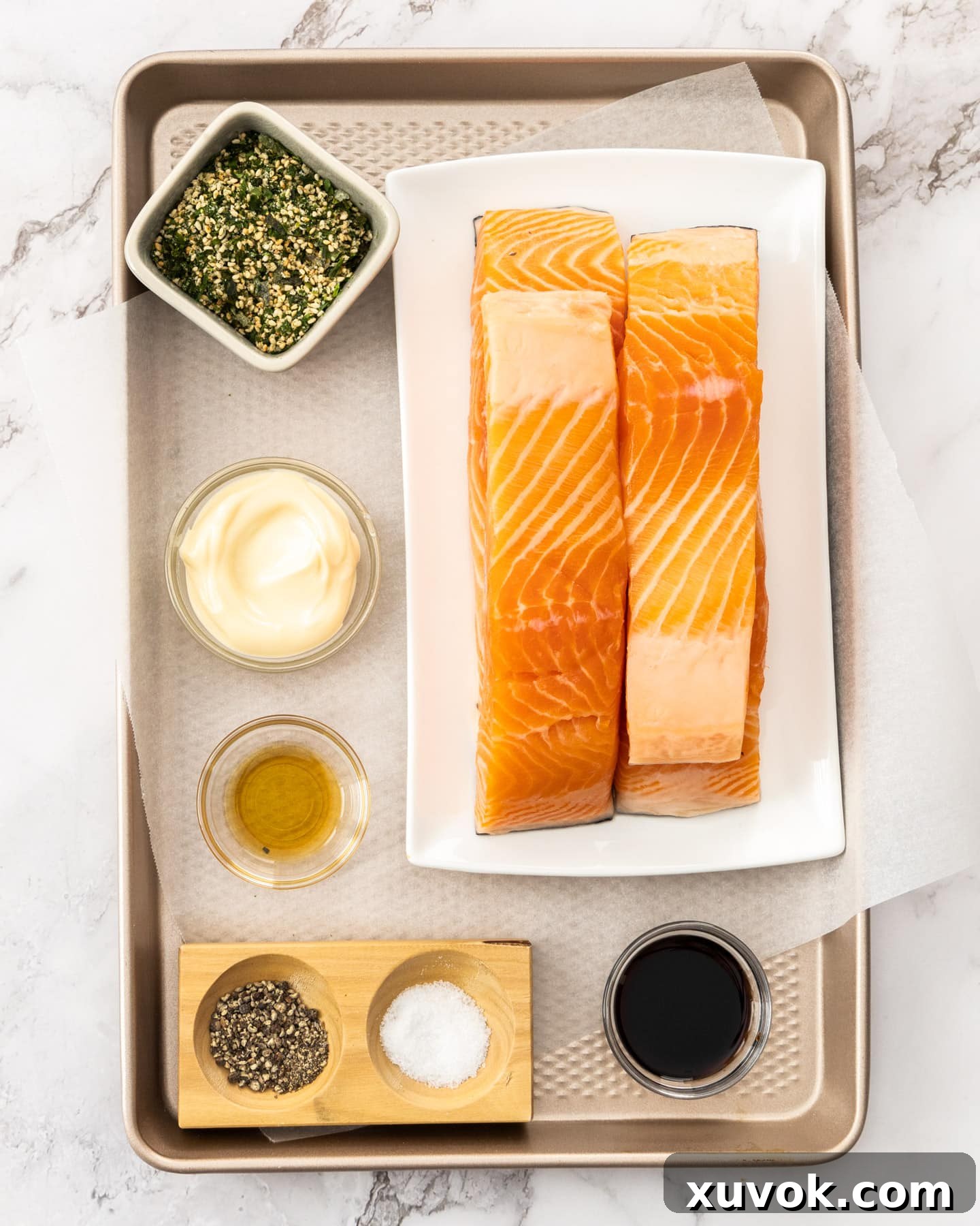 All the essential ingredients for furikake salmon, neatly arranged on a baking tray, ready for preparation.