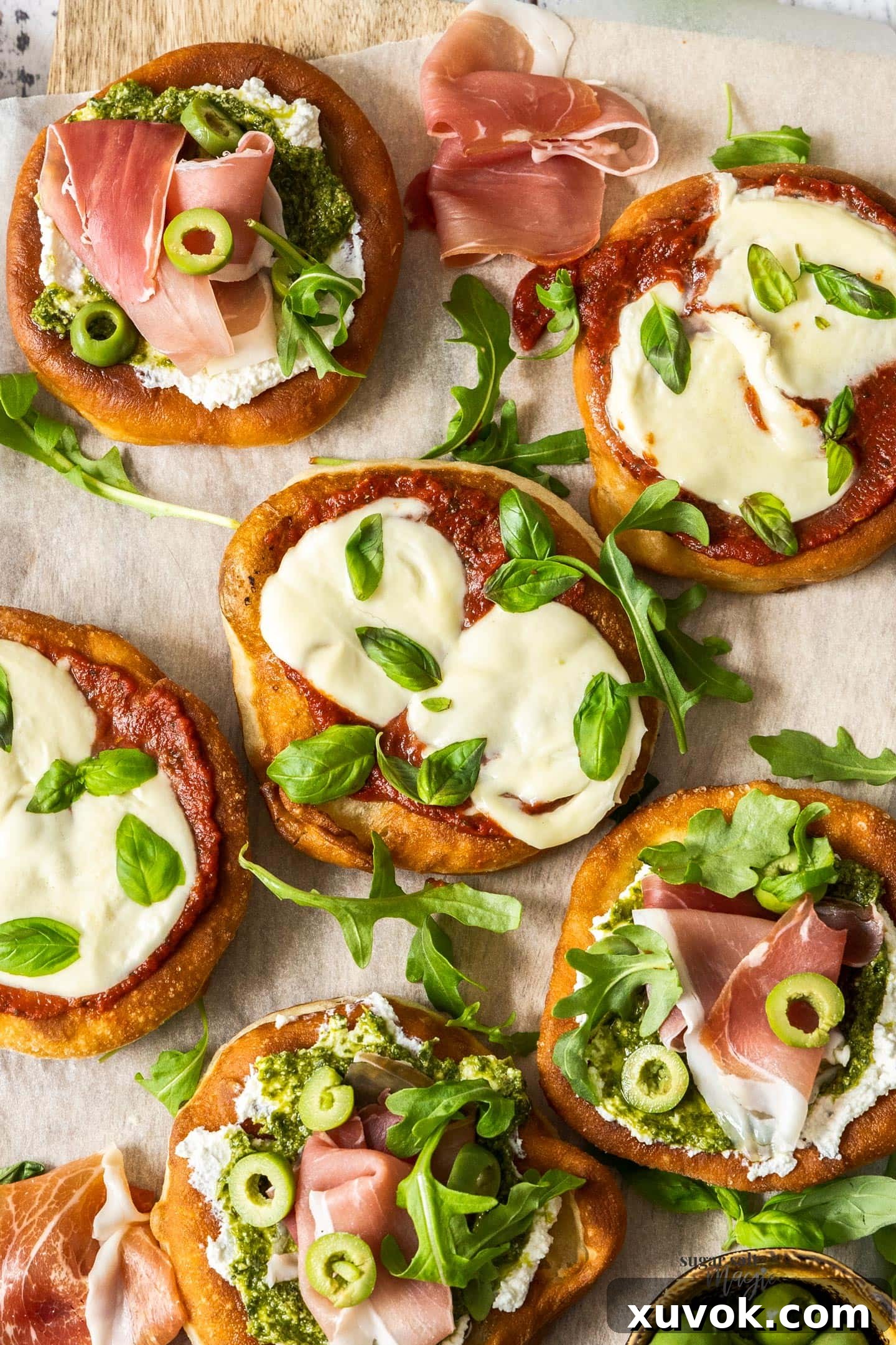 Top down view of 6 pizza fritta on a wooden board.