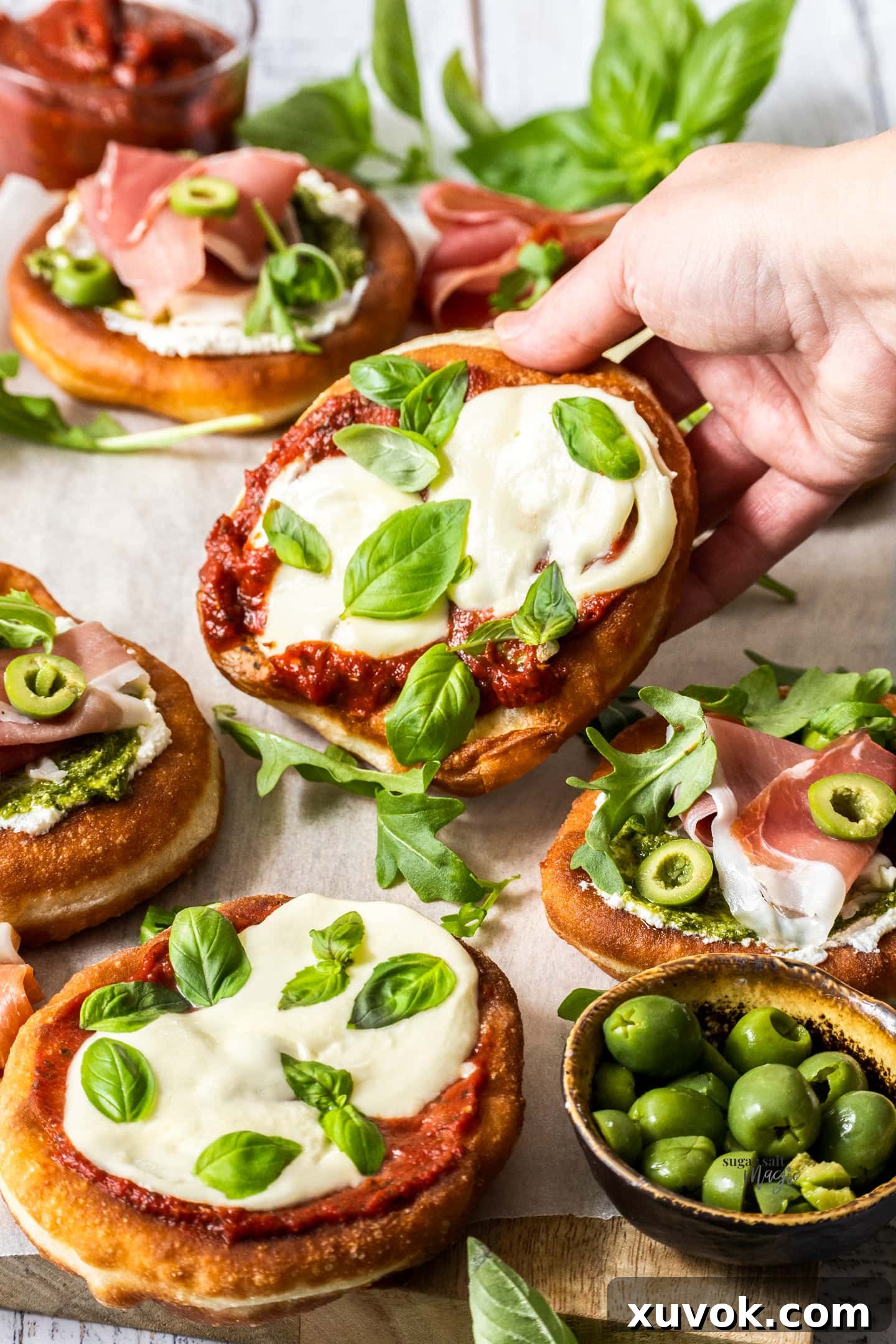 A hand holding a pizza fritta.