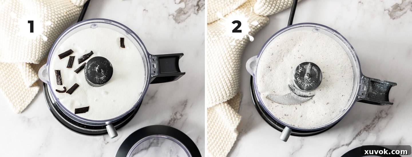 A vanilla bean cut into pieces on top of sugar in a food processor, ready for blending.