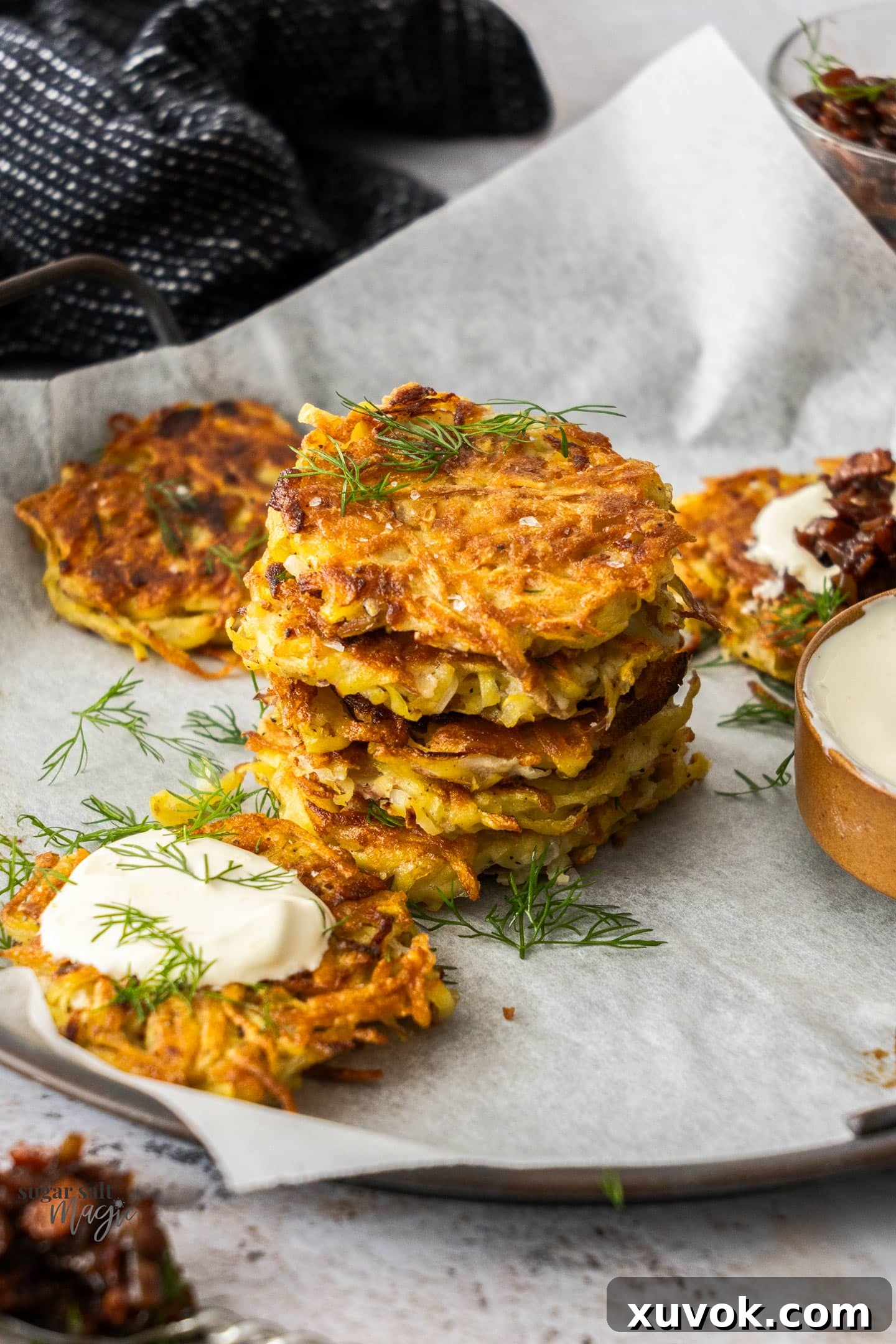 A stack of 5 golden, crispy potato fritters, perfectly tender inside and tasty, ideal for breakfast, a side dish, or an appetizer.