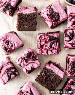 A batch of blueberry chocolate cake slices on a platter, ready to be served.
