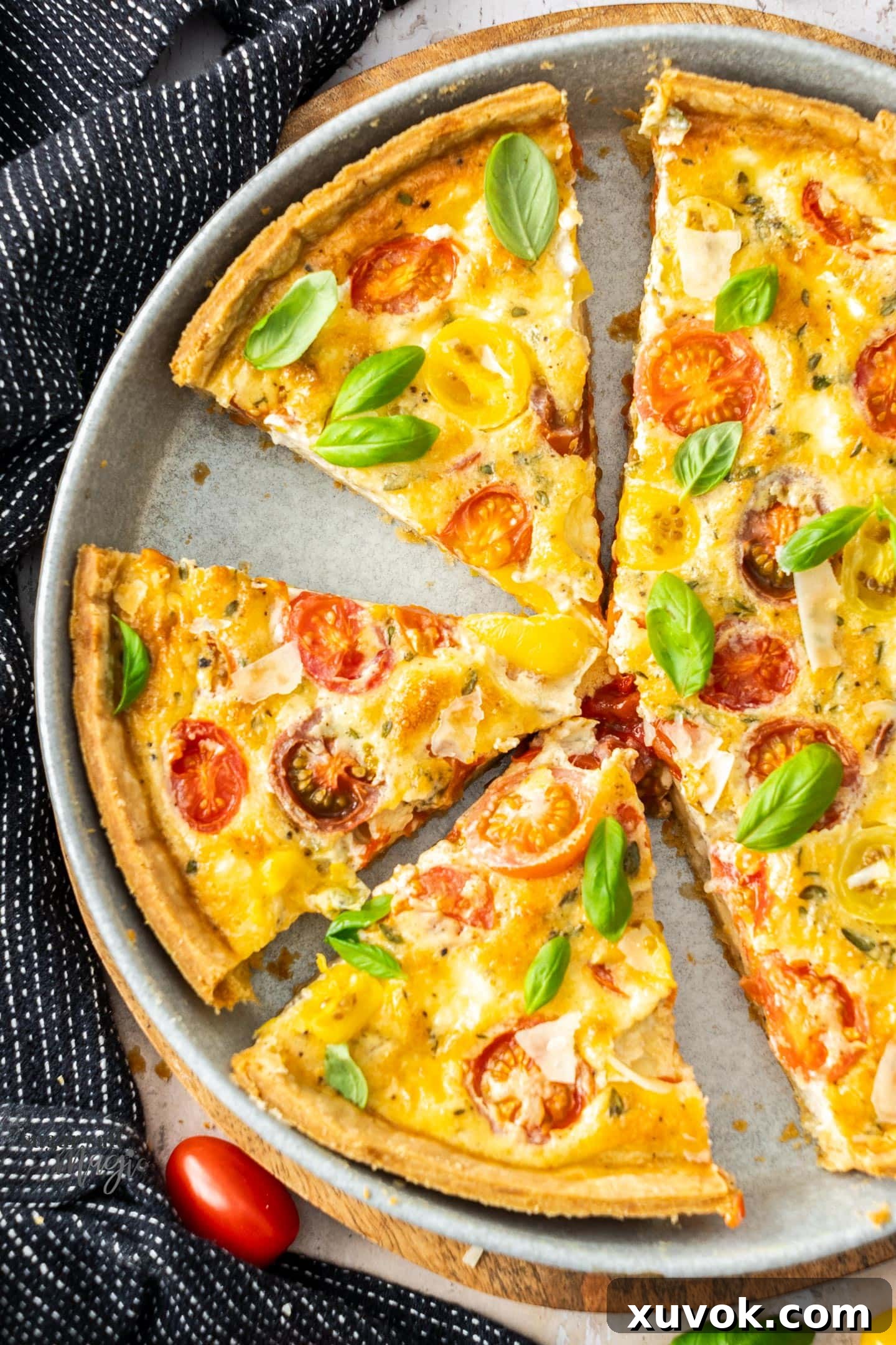 A quiche cut into slices.