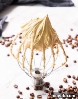 Coffee buttercream on a balloon whisk.