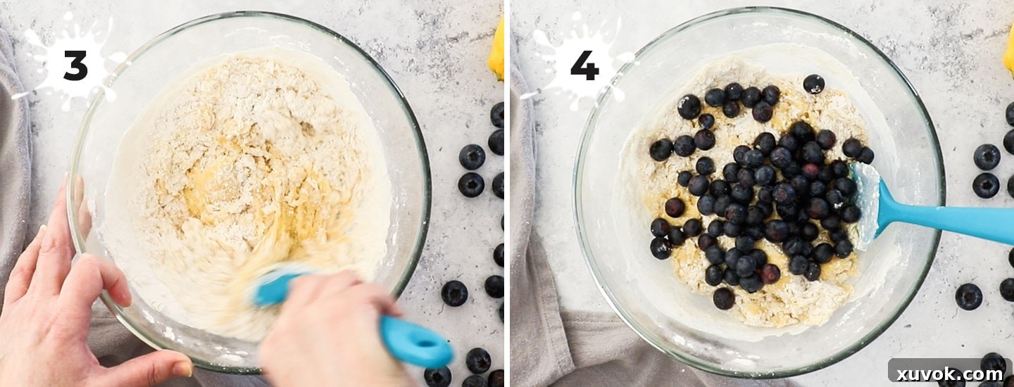 Adding the flour and blueberries to the cookie dough.